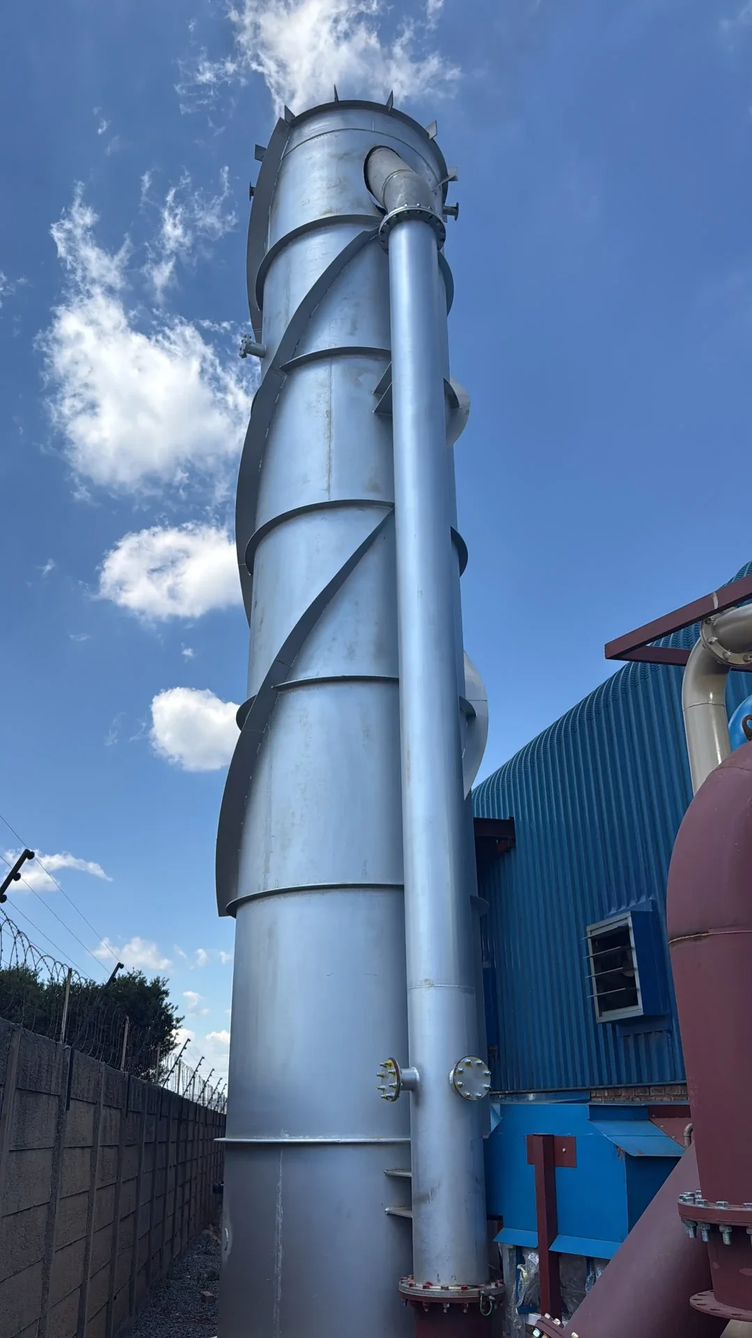 Tall emissions treatment stack